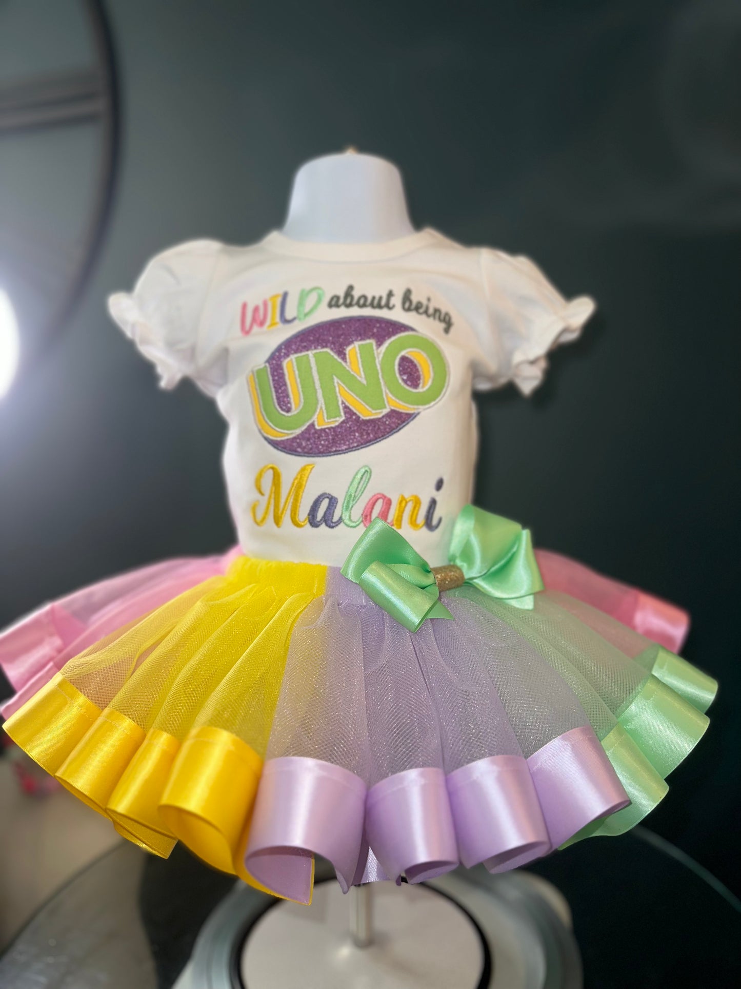 wild about being uno tutu set, girls first birthday, pastel colors, wild about being uno logo. white puff sleeve shirt. matching skirt and waist bow