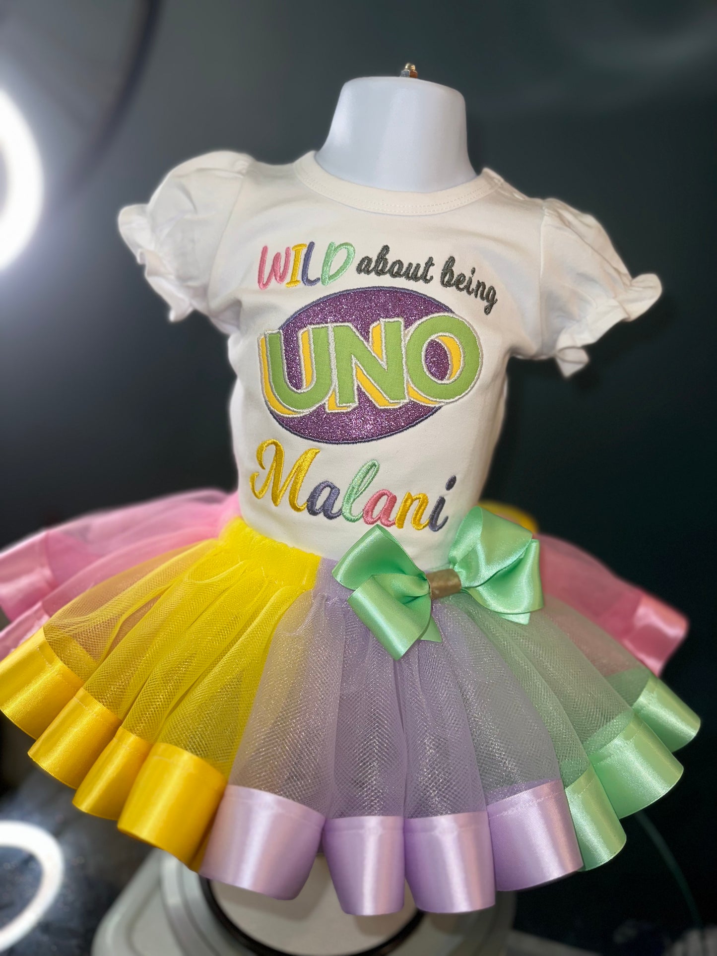 wild about being uno tutu set, girls first birthday, pastel colors, wild about being uno logo. white puff sleeve shirt. matching skirt and waist bow