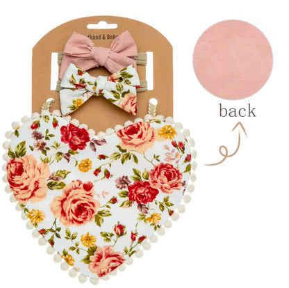 Two-sided floral printed, heart shaped bibs with matching bows