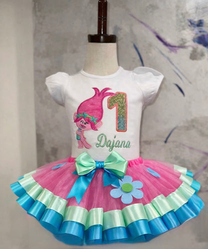 Personalized trolls first birthday outfit on toddler girl with pink tulle skirt and mint and turquoise ribbon trim