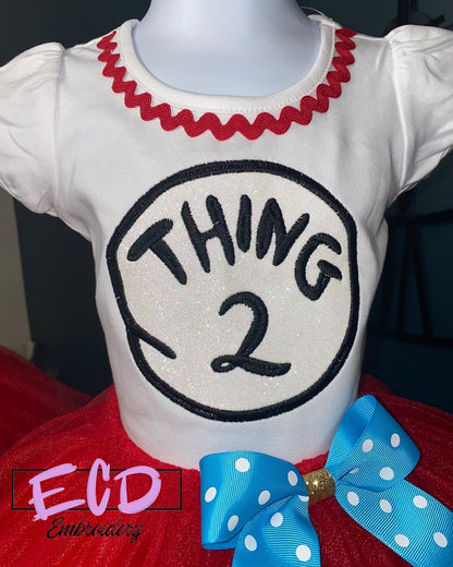 Thing 1 and thing 2 theme birthday outfit for girls. Embroidered on white puff sleeved cotton shirt