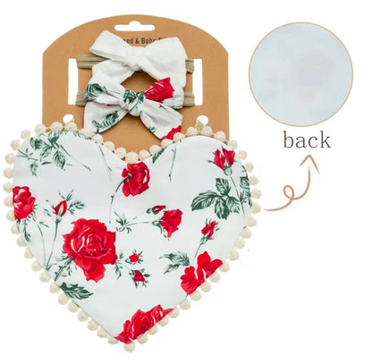 Two-sided floral printed, heart shaped bibs with matching bows