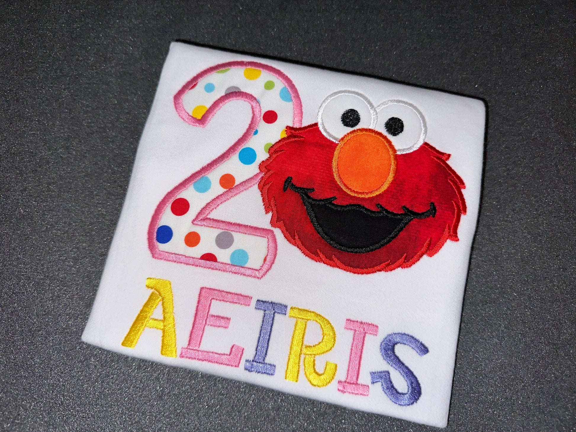 WHITE ELMO BIRTHDAY SHIRT FOR GIRLS. COMBED COTTON MATERIAL WITH EMBROIDERED AGE, NAME AND IMAGE