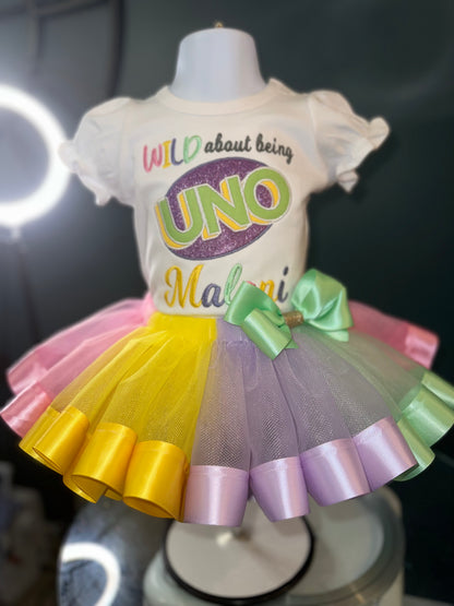 wild about being uno tutu set, girls first birthday, pastel colors, wild about being uno logo. white puff sleeve shirt. matching skirt and waist bow
