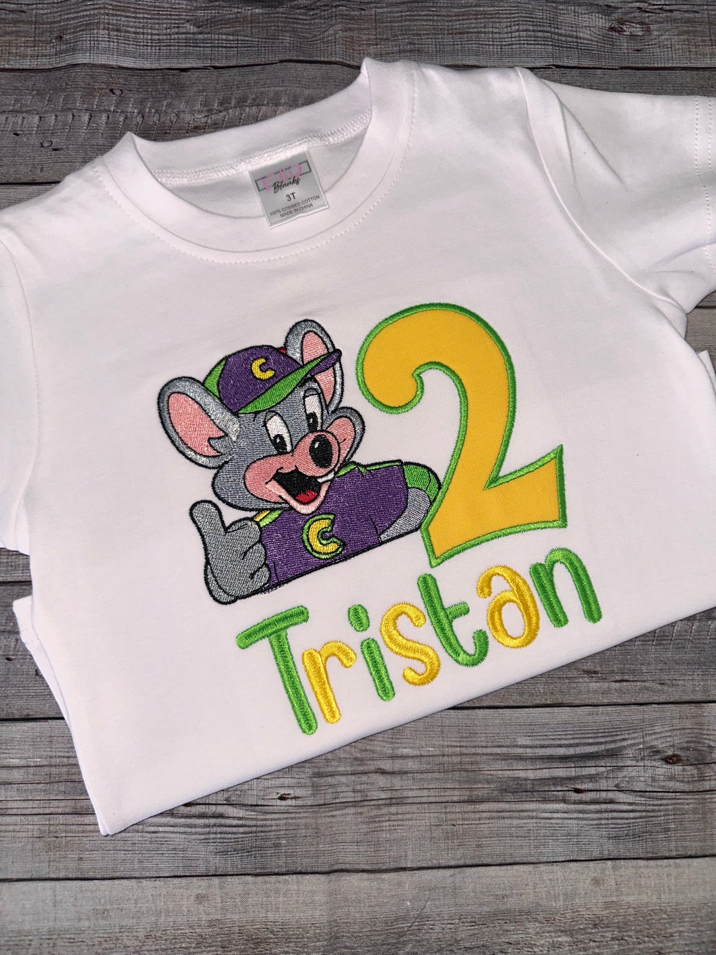 White embroidered Chuck E. Cheese birthday outfit 