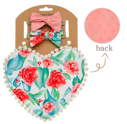 Two-sided floral printed, heart shaped bibs with matching bows