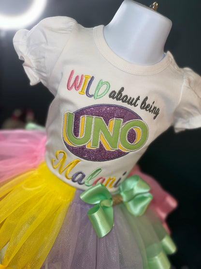 wild about being uno tutu set, girls first birthday, pastel colors, wild about being uno logo. white puff sleeve shirt. matching skirt and waist bow