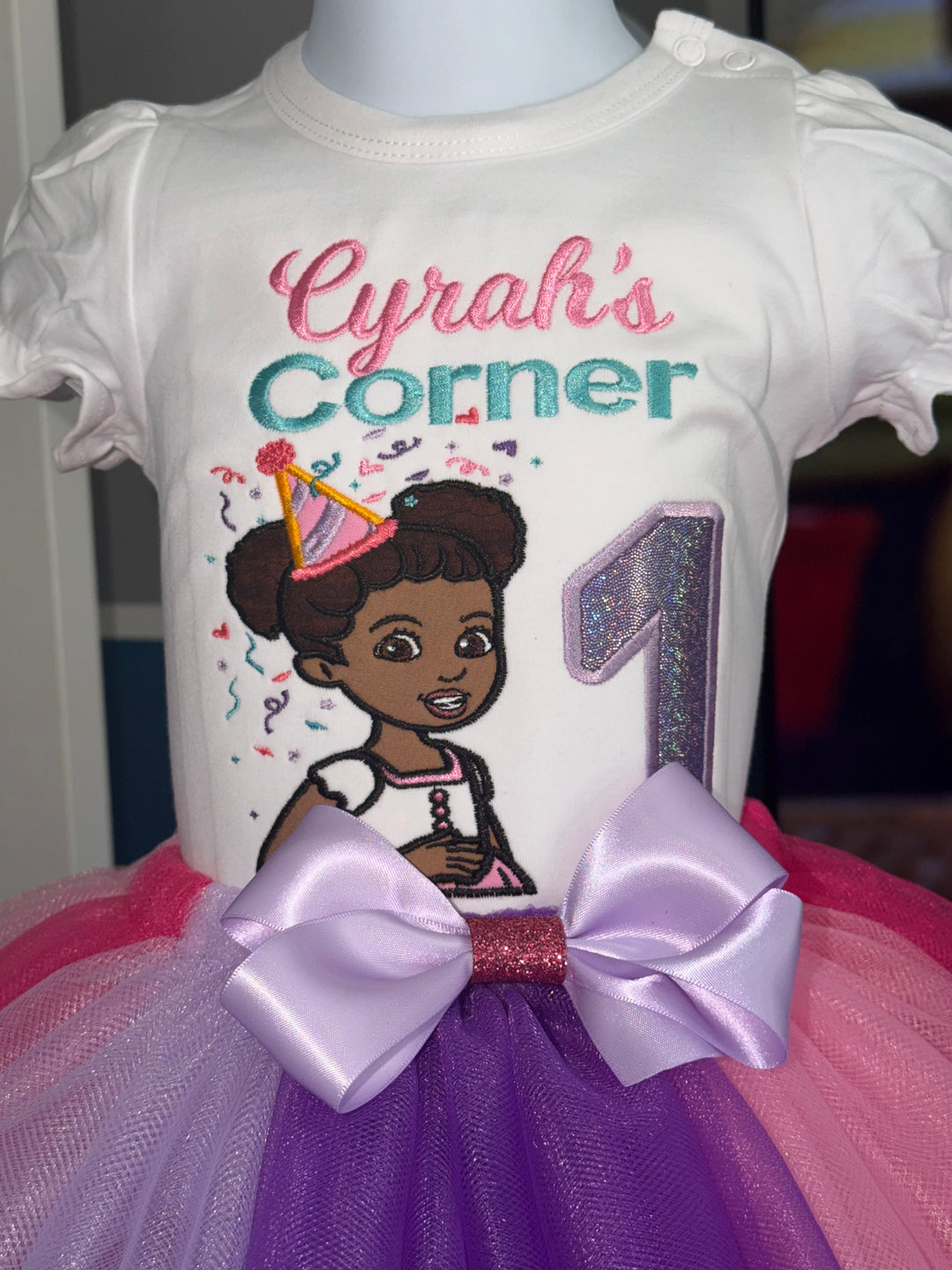 Baby outfit with cartoon character and text on a mannequin