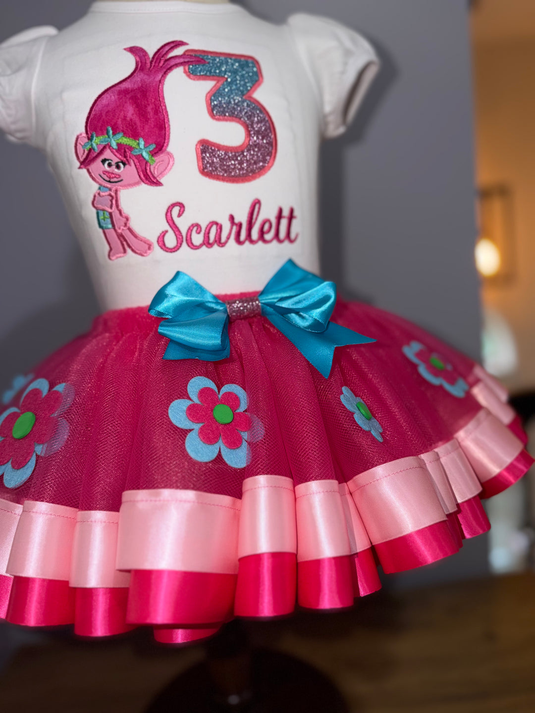 Personalized Poppy Trolls birthday shirt paired with a pink flower tutu skirt and satin bow