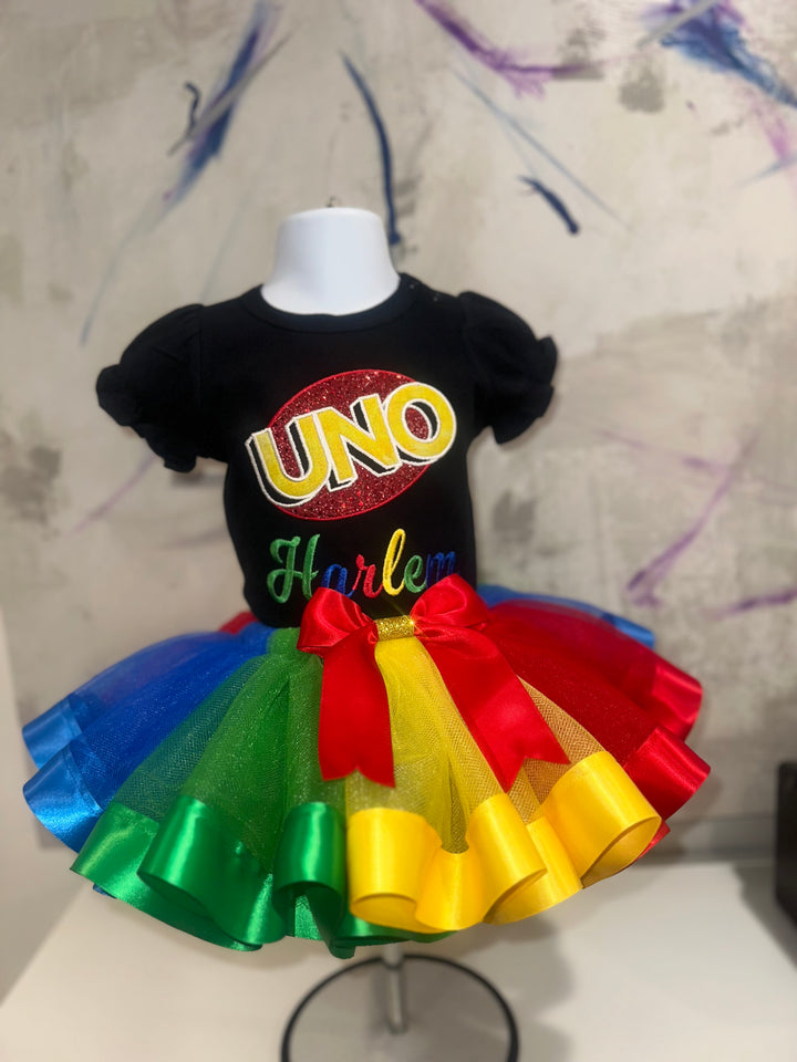 Custom uno themed outfit for girls. On a mannequin. Tutu colors blue green yellow and red 