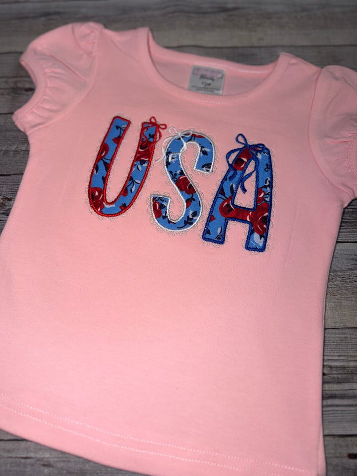 boutique patriotic girls clothing featuring a handmade embroidered usa applique shirt with puff sleeve