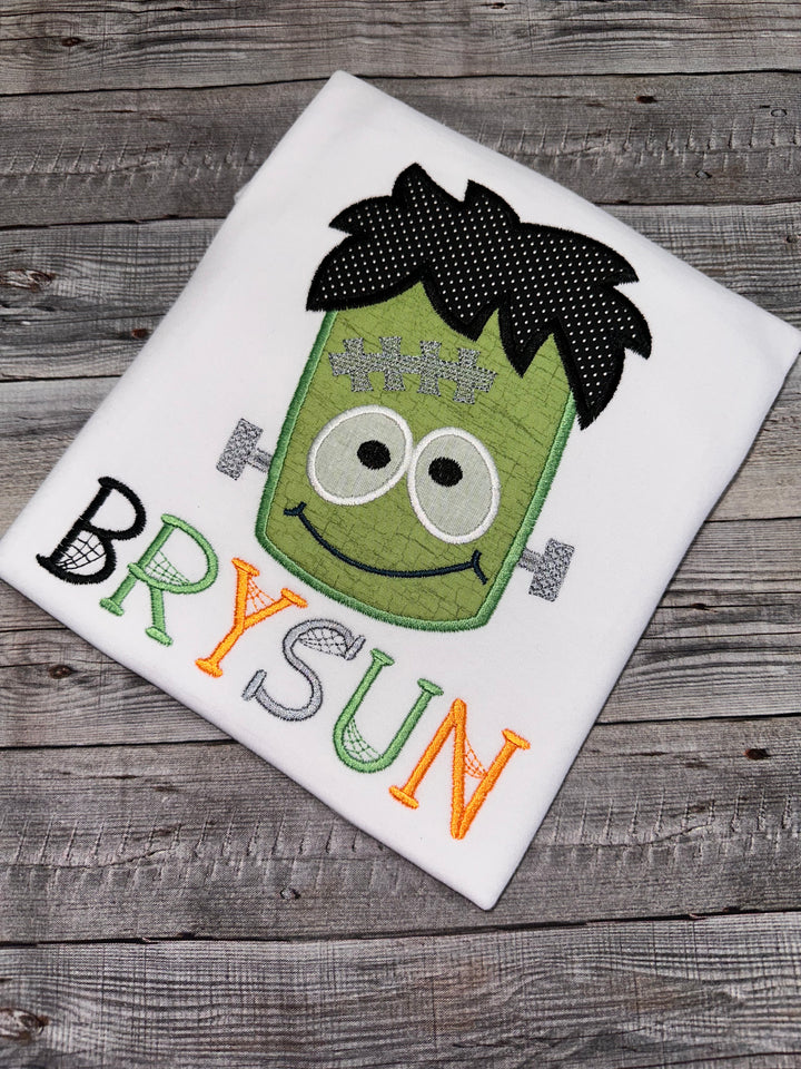 Frankenstein Halloween shirt featuring a cute embroidered monster design
