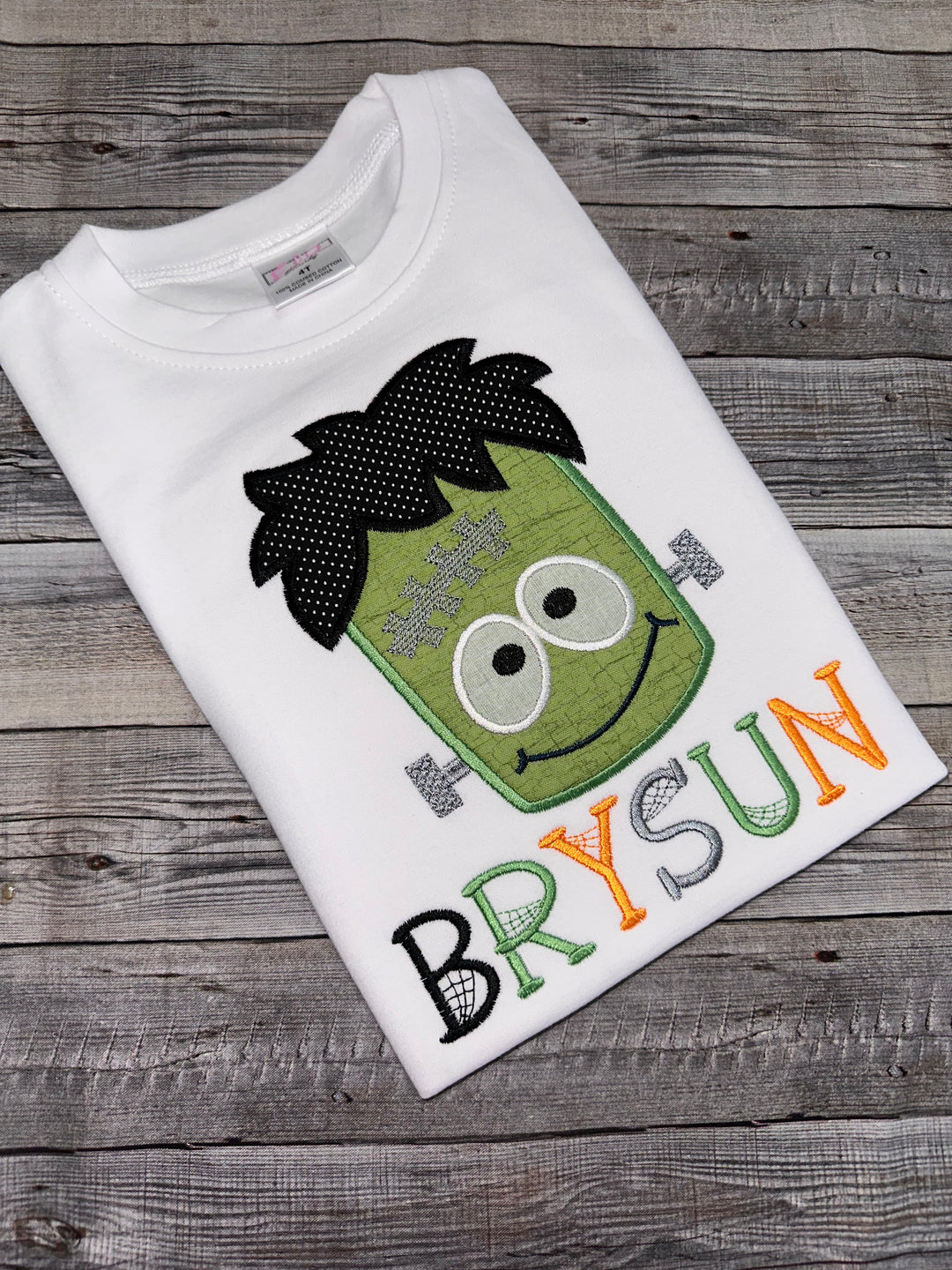 Kids Frankenstein Halloween shirt personalized with name and colorful embroidered monster