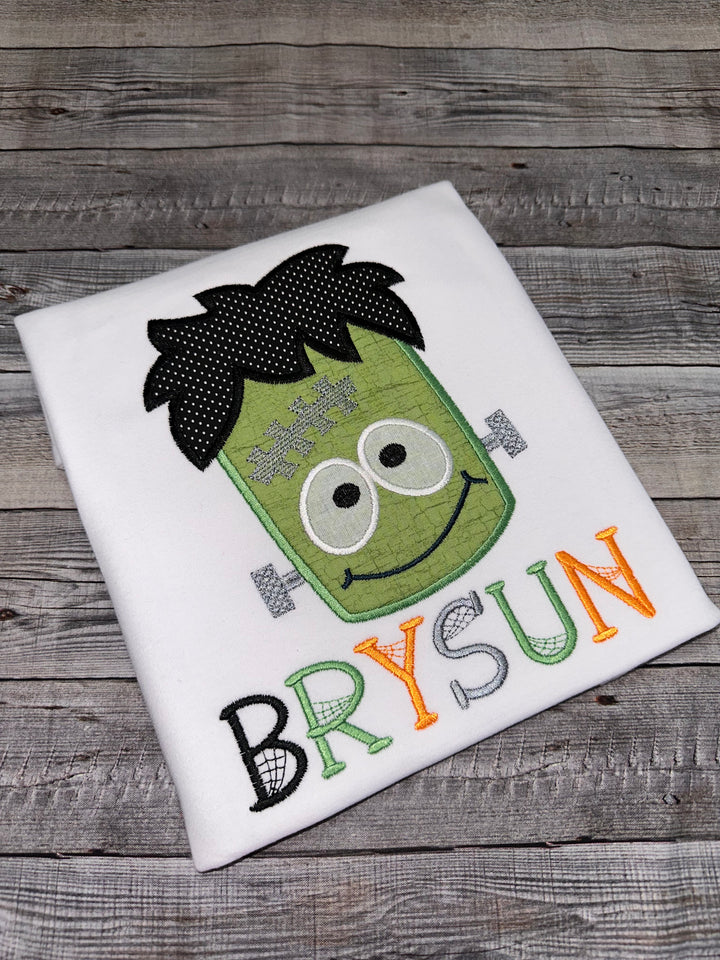 Frankenstein shirt with embroidered green monster design for Halloween